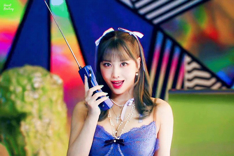 Twice MOMO talks with an early 90s mobile phone.gif